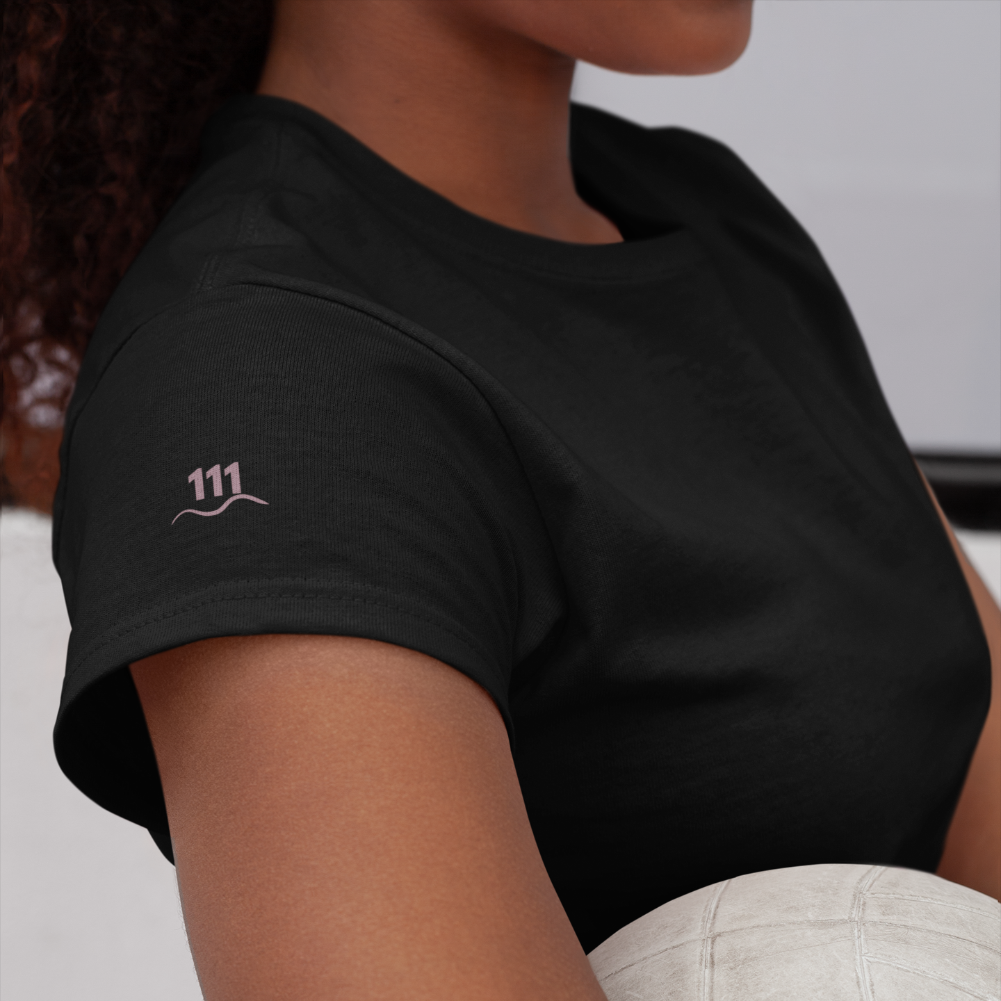 Black Eclipse T-shirt with subtle mauve 111 angel number and wave line printed on the left sleeve — Soft Frequencies™ alignment wear for divine awakening and new energy