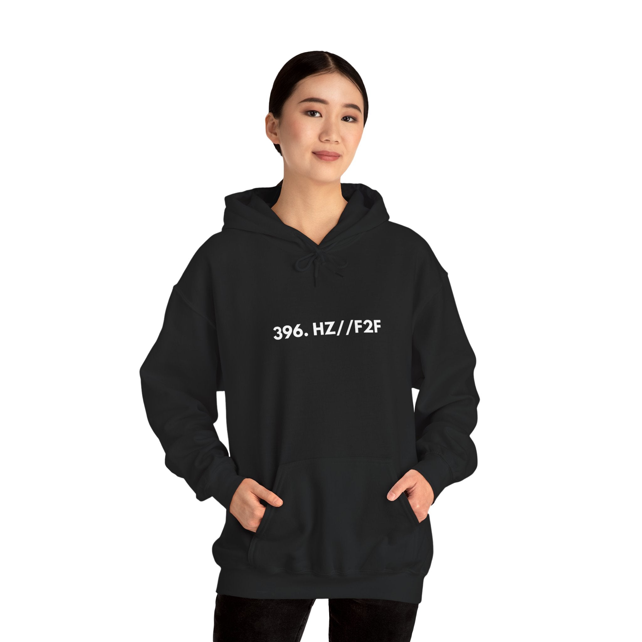 Person wearing a black hoodie with 396 Hz F2F on a white background