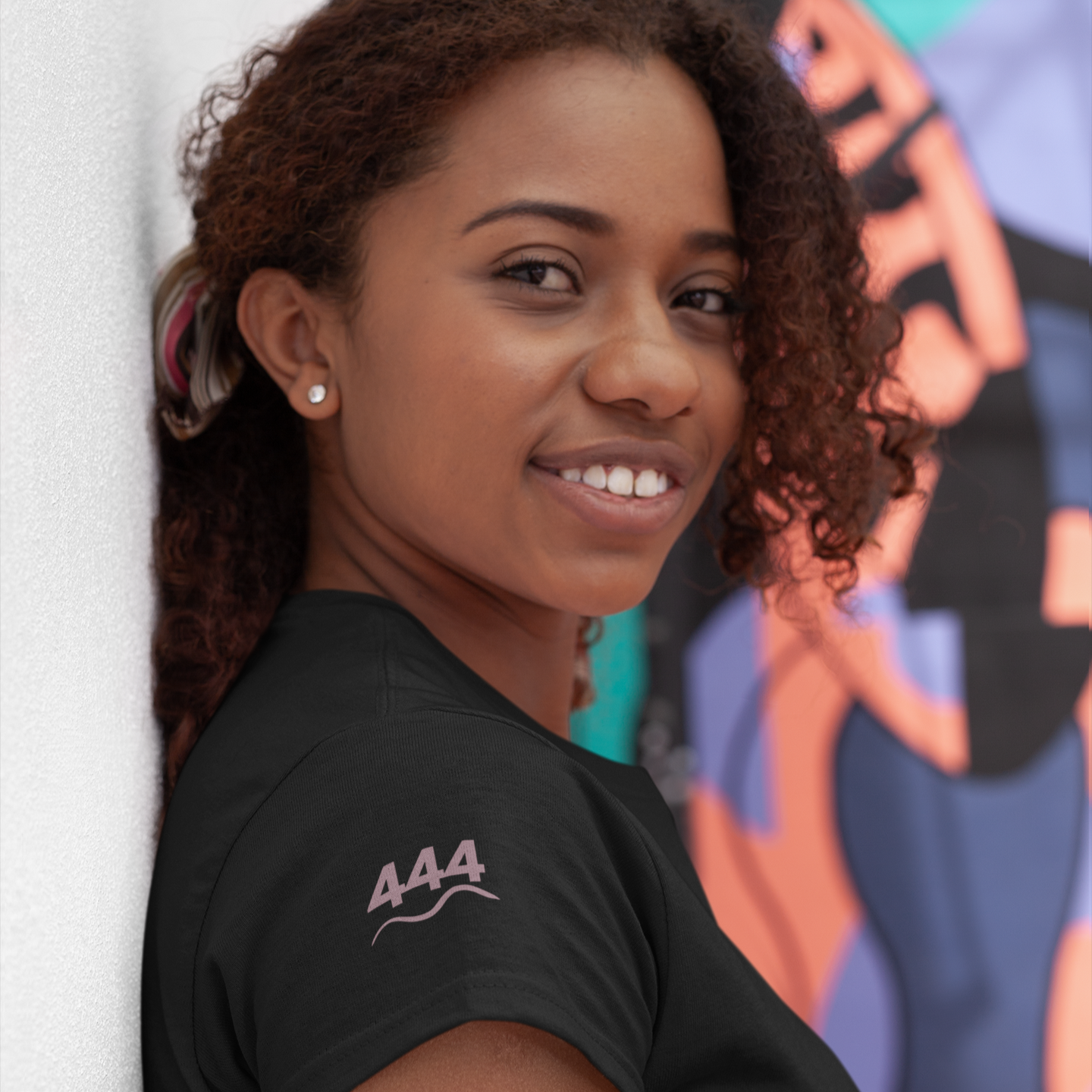 Eclipse black T-shirt featuring 444 angel number and wave symbol on the sleeve in mauve — a soft frequencywear piece for grounding and spiritual protection