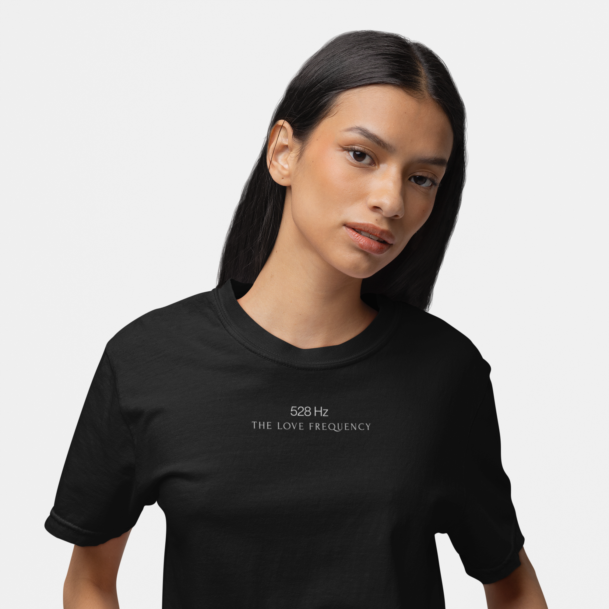 Woman wearing Soft Frequencies™ frequencywear™ t-shirt in Eclipse and Bay — minimalist spiritual