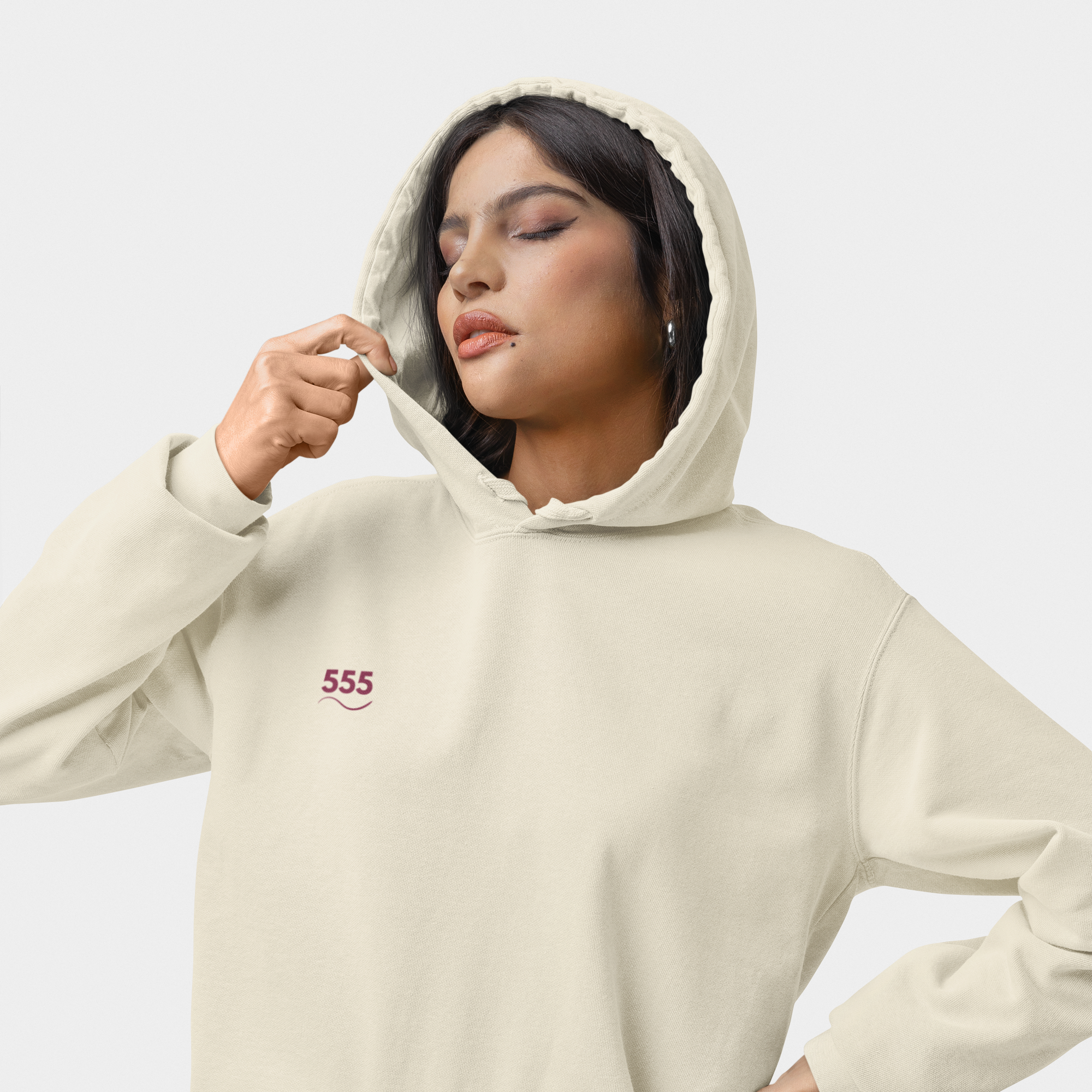 Woman wearing the 555 Shift Hoodie in Solace white — hip-height spiritual hoodie set at 432 Hz for divine transformation